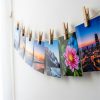 Personalised borderless prints with custom text hung on wooden clips - Memoriffy India